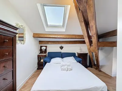 a bedroom with a bed and a skylight at Appartement Atypique cœur de ville -AC- in Nice
