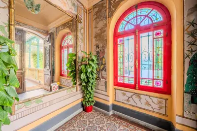 a room with stained glass windows and a plant at Appartement Atypique cœur de ville -AC- in Nice