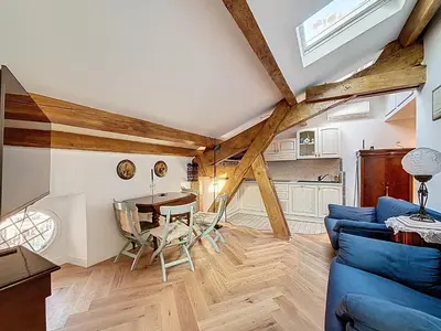 a living room with a blue couch and a table at Appartement Atypique cœur de ville -AC- in Nice