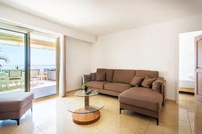 a living room with a couch and a table at EZE VISTA AP4328 By Riviera Holiday Homes in Èze