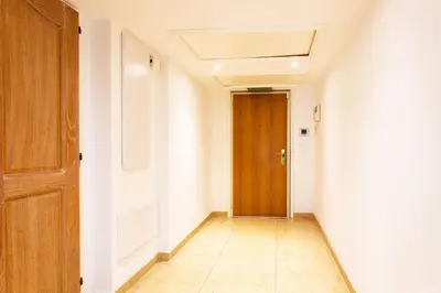 a hallway with a wooden door in a room at EZE VISTA AP4328 By Riviera Holiday Homes in Èze