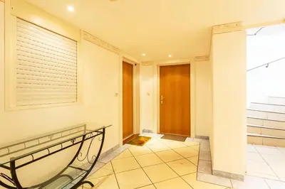 a hallway with a glass railing and a door at EZE VISTA AP4328 By Riviera Holiday Homes in Èze