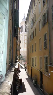 a view of an alley between two buildings at Vieux Nice 2 pièces Appartement SAN REMO in Nice