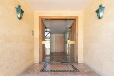 an entrance to a building with a glass door at L34 Hermès Suite terrace parking AC 2mins SEA in Saint-Jean-Cap-Ferrat