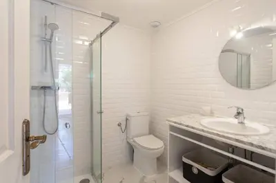 a bathroom with a toilet and a sink and a shower at L34 Hermès Suite terrace parking AC 2mins SEA in Saint-Jean-Cap-Ferrat