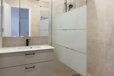 a bathroom with a sink and a mirror at L39 Suite Promenade des Anglais, Vue Mer Terrasse&WIFI in Nice