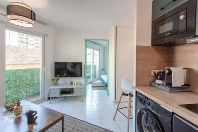a kitchen with a dishwasher and a living room at L44 1BDR Flat 10mins walk to port/Balcon, Parking, AC in Nice