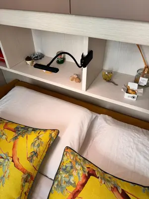 a bedroom with a bed with a shelf above it at Grimaldi Central AC 2 terraces Wifi 5mins SEA in Nice