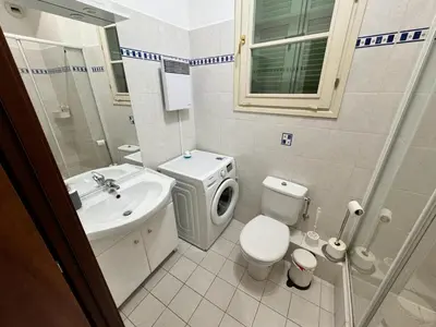 a small bathroom with a toilet and a sink at Grimaldi Central AC 2 terraces Wifi 5mins SEA in Nice