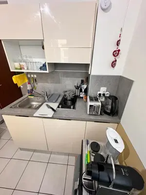 a kitchen with a sink and a counter top at Grimaldi Central AC 2 terraces Wifi 5mins SEA in Nice