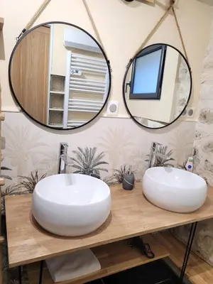 two sinks in a bathroom with two mirrors at Chaleureuse bergerie rénovée. in Tourrette-Levens