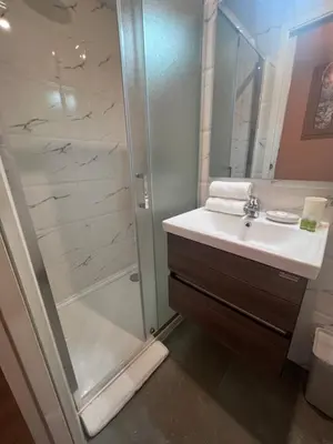 a bathroom with a sink and a shower at La cour du centre Nice Verde in Nice