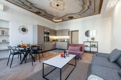 a living room with a couch and a table at MY CASA - PHILIBERT - Traditional Apart with Historical Fresc in Nice