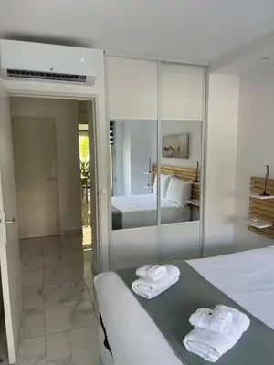 a bedroom with a bed with towels on it at Superbe appartement carré Delfino Port de Nice in Nice