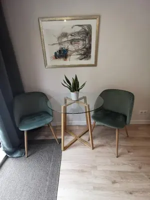 two chairs and a glass table with a plant on it at Villa Soleil Levant in Nice
