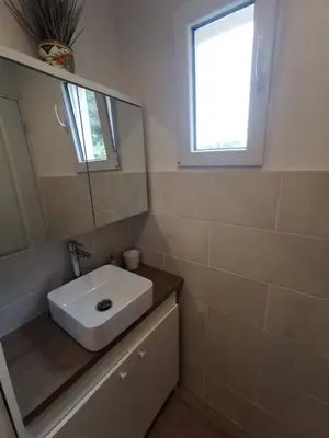 a bathroom with a white sink and a mirror at Villa Soleil Levant in Nice
